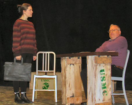 a woman holding a briefcase before a man at a makeshift desk